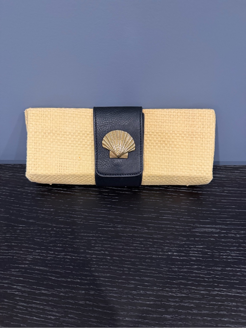 Woven Straw Clutch with Black Leather Strap and Gold Shell Accent